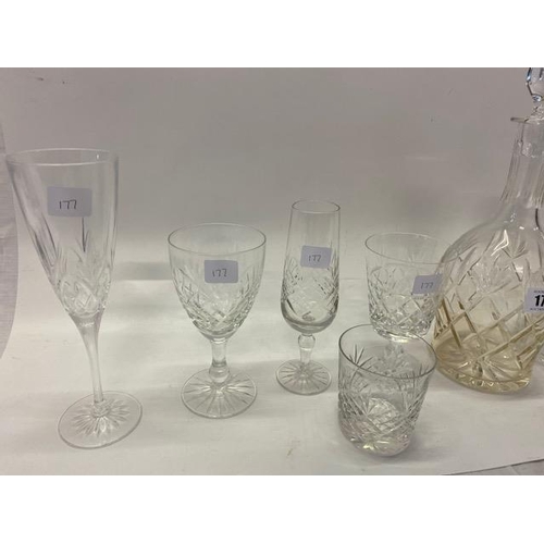 177 - A quantity of near matching slice cut table glass including champagnes, goblets, two decanters etc..