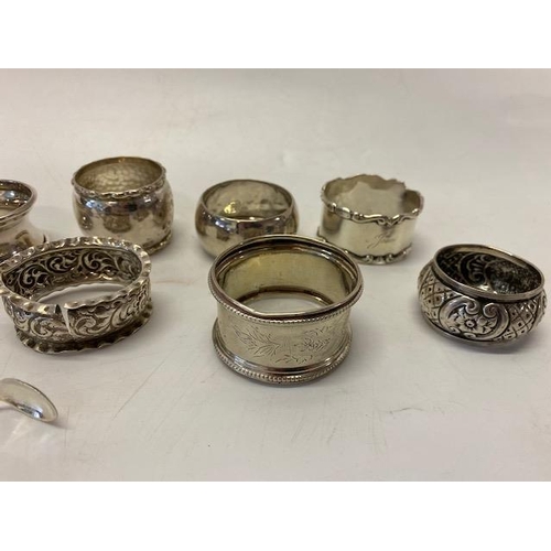 191 - Five silver napkin rings various, three other silver coloured metal napkin rings and a pair of silve... 