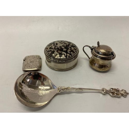 193 - A small plain silver lidded mustard with blue glass liner, a silver vesta case with engraved decorat... 