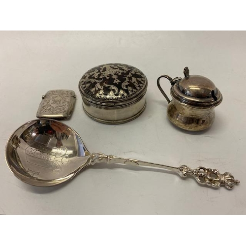 193 - A small plain silver lidded mustard with blue glass liner, a silver vesta case with engraved decorat... 