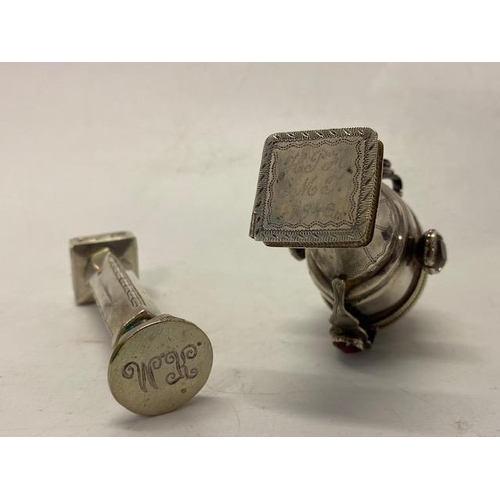 194 - A 19th Century silver coloured metal seal with urn form handle with hinged lid inset coloured stones... 