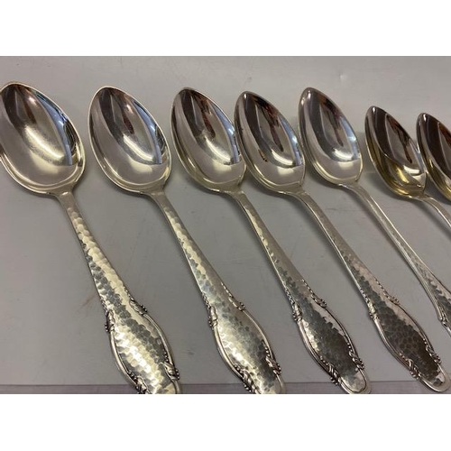 196 - Nine Danish silver tablespoons with hammered and shaped handles, various makers