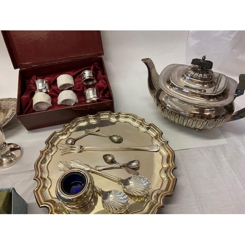 203 - A selection of silver plated items including bottle coasters, teapot, flatware, novelty cocktail sti... 