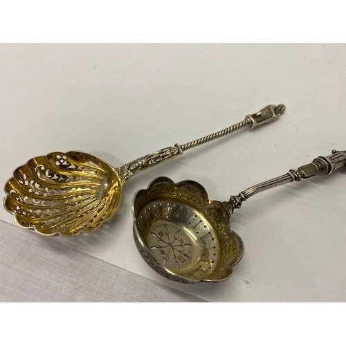 218 - A Victorian silver sugar sifting spoon with gilt shell pattern bowl and Apostle terminal - London 18... 