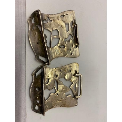 221 - A silver nurse's buckle with pierced floral and figural decoration - Birmingham 1901, makers marks f... 