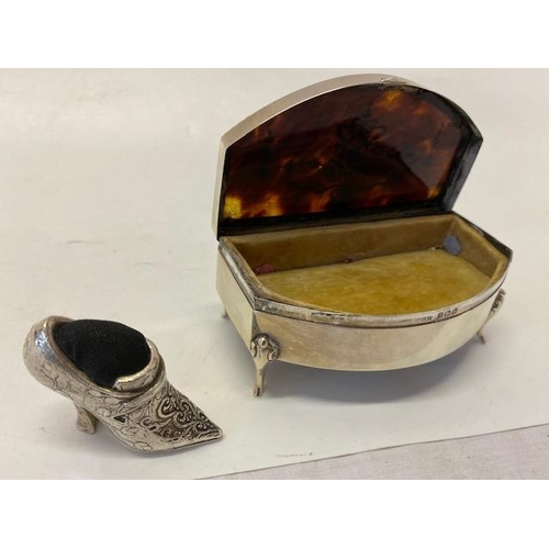 234 - A silver coloured metal pin cushion in the form of a shoe and a silver trinket box, the tortoiseshel... 