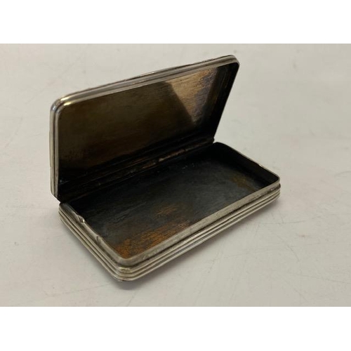 235 - A Continental silver snuff box, the lid with engraved decoration of farm buildings within scroll bor... 