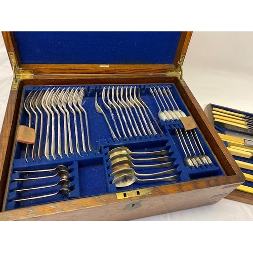 248 - An oak canteen box containing silver plated flatware on three trays