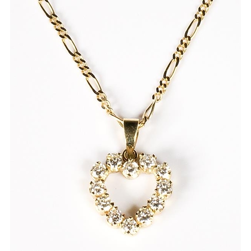 286 - A lady's diamond set heart shaped pendant mounted in 18ct. gold on a fancy 18ct. gold chain