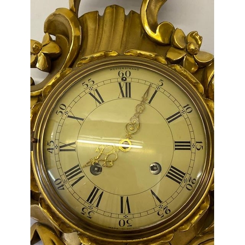 293 - A cartel clock with white enamel dial, Swedish movement, in a gilded metal leaf scroll case - 23in. ... 