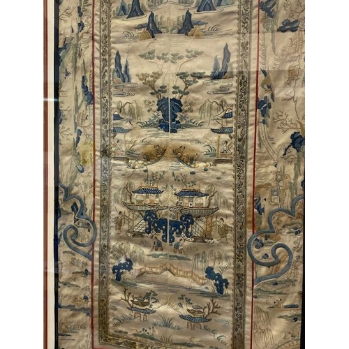 300 - A Chinese silkwork panel embroidered with pagodas, figures, bridges etc.., mounted, framed and glaze... 