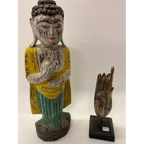 304 - A painted carved wood figure of a Buddha - 20 1/2in. high and an Indian painted wood hand on square ... 