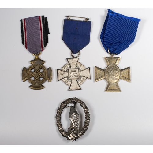 338 - Four replica German Second World War medals and badges