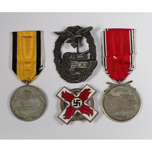 339 - Four replica German Second World War medals and badges