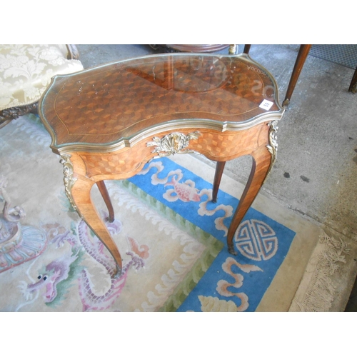 59 - A French walnut and kingwood occasional table with cube style inlaid top, brass bound, frieze drawer... 