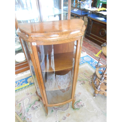 90 - A French kingwood vitrine with glass door and sides, on slender cabriole legs with gilt metal mounts... 