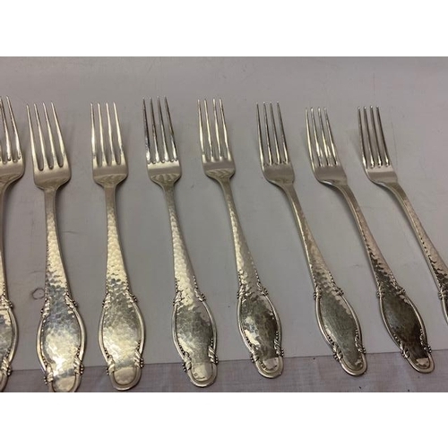 198 - Twelve Danish silver desert forks with hammered and shaped handles, various makers