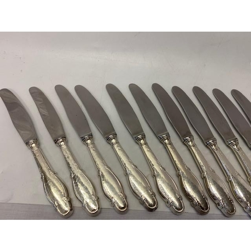 200 - Sixteen Danish knives with silver covered handles