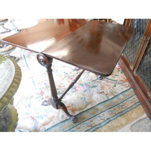 63 - A Victorian mahogany Sutherland table with roll top, two deep drop flaps, on turned legs and feet - ... 