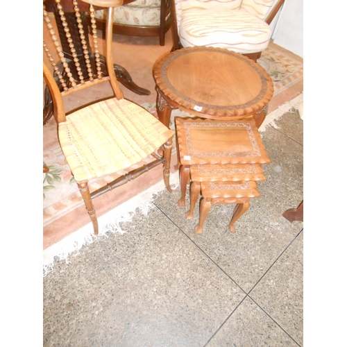 74 - A circular Kashmir walnut occasional table with carved decoration, a nest of three similar tables an... 