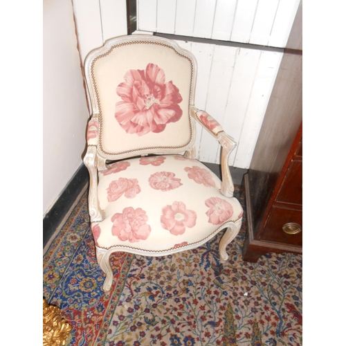 77 - A pair of reproduction limed oak fauteuils upholstered in pink floral pattern material