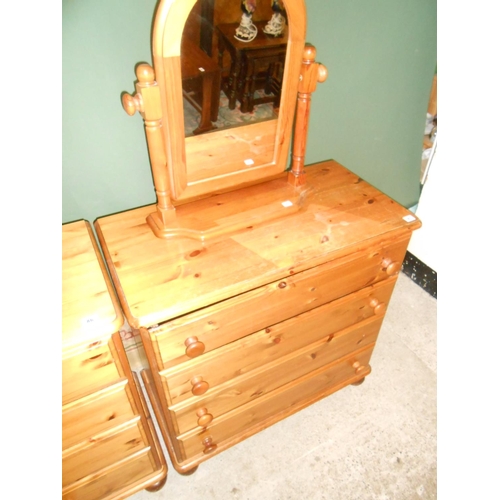 87 - A modern pine chest fitted four drawers and a modern pine framed swing toilet mirror