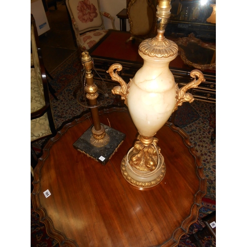 97 - A gilt wood and alabaster tablelamp base with gilded dolphin supports to the base and a brass and bl... 