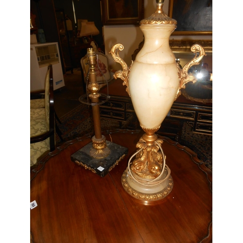 97 - A gilt wood and alabaster tablelamp base with gilded dolphin supports to the base and a brass and bl... 