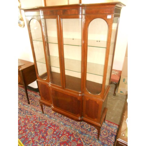 110 - An Edwardian mahogany display cabinet, the upper part fitted two centre doors flanked by glass sides... 