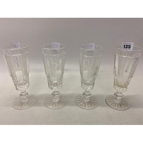 135 - A set of four Waterford Crystal champagne flutes