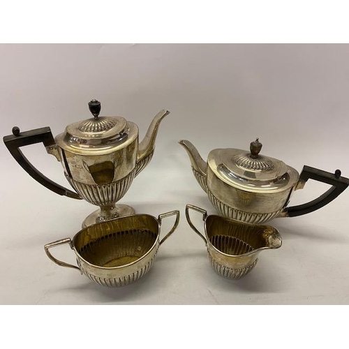 152 - A silver three piece tea and coffee service with half fluted decoration - London 1918, makers marks ... 