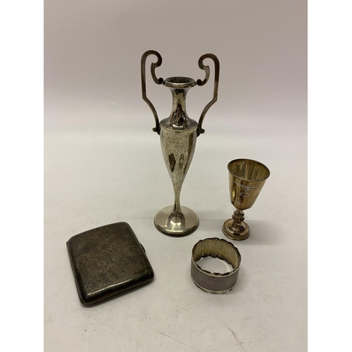 161 - A silver engine turned napkin ring, a silver Kiddush cup and a silver cigarette case and a Continent... 