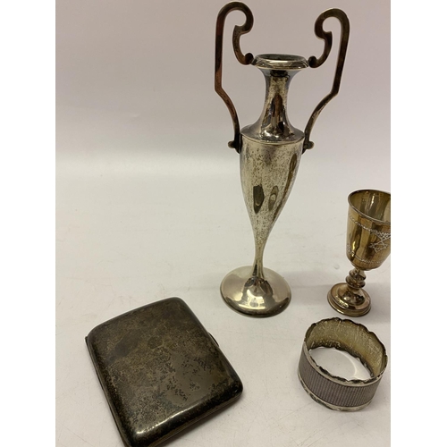 161 - A silver engine turned napkin ring, a silver Kiddush cup and a silver cigarette case and a Continent... 