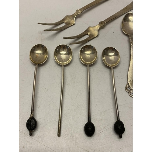 166 - A pair of Norwegian silver cake forks, a Norwegian silver teaspoon, four silver coffee spoons and a ... 