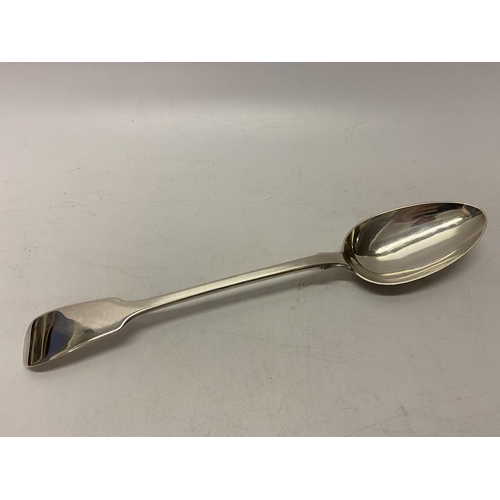 178 - A Georgian silver basting spoon with fiddle pattern handle - London 1813, makers marks for William C... 