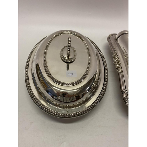 182 - A rectangular silver plated entree dish and cover with leaf scroll handle, an oval silver plated ent... 