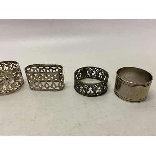 191 - Two silver napkin rings, a napkin ring with plique a jour style enamel decoration and four silver pl... 