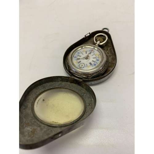 196 - A lady's fob watch, white enamel dial, in a Continental silver case, complete with metal protective ... 