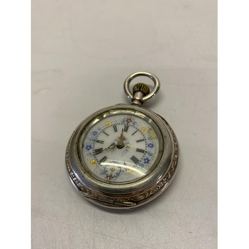 196 - A lady's fob watch, white enamel dial, in a Continental silver case, complete with metal protective ... 