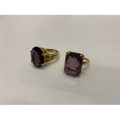 198 - A lady's ring set amethyst coloured stone, on a gold coloured metal shank and a lady's ring set amet... 