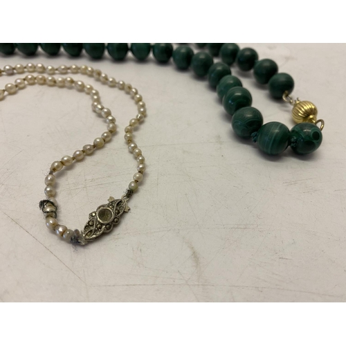 211 - A row of graduated pearls with silver and pearl set clasp and a row of malachite beads with 18ct. go... 