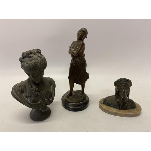 264 - A bronze study of a lady with her arms folded, on circular black marble base - 11in. high, head and ... 