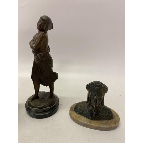 264 - A bronze study of a lady with her arms folded, on circular black marble base - 11in. high, head and ... 