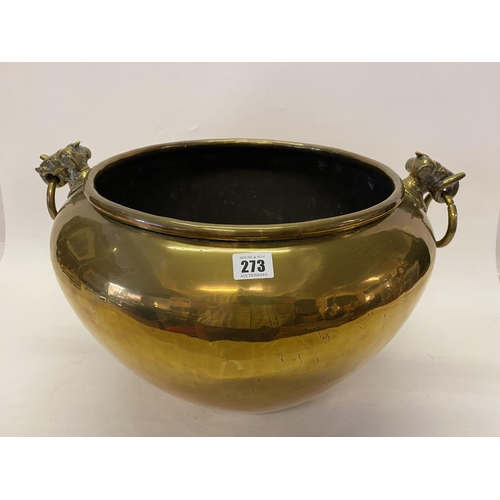 273 - An antique brass jardiniere with stylised elephant masks, ring handles - 18in. dia.