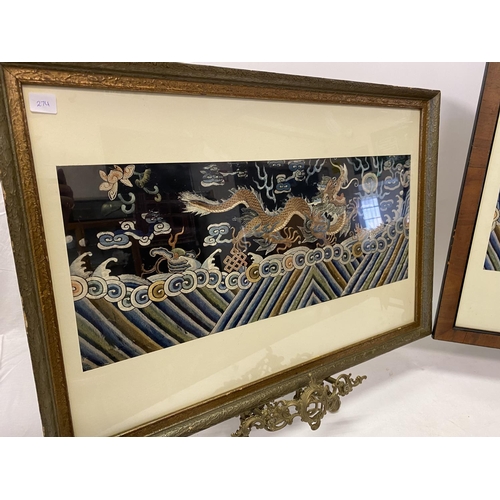 274 - A pair of Chinese silkwork panels, blue ground decorated dragons, framed and glazed