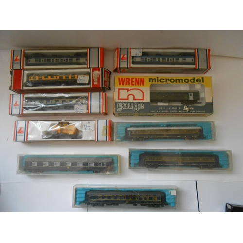 352 - A Minitrix railway engine and a selection of rolling stock comprising:- four Rivarossi, seven Lima, ... 