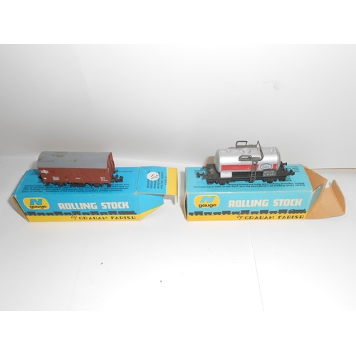 352 - A Minitrix railway engine and a selection of rolling stock comprising:- four Rivarossi, seven Lima, ... 