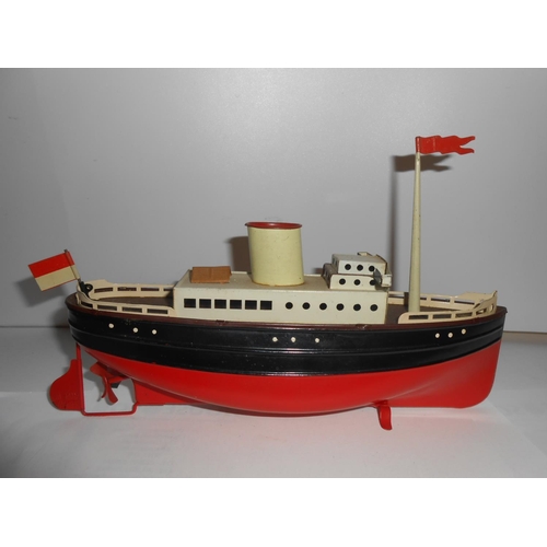 363 - Two German clockwork tin plate models of steam boats - 12in. and 9in. long