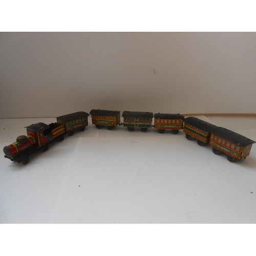 365 - Two Japanese small tin plate clockwork railway engines and ten items of rolling stock and a miniatur... 