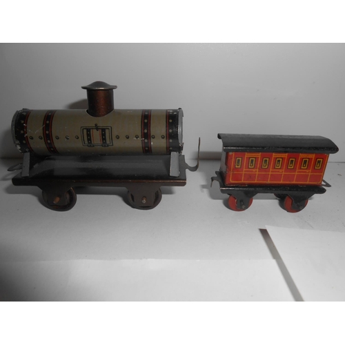 366 - Fifteen items of tin plate rolling stock and a clockwork engine